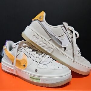 Nike Women's White Sneakers with Yellow and Purple Accents